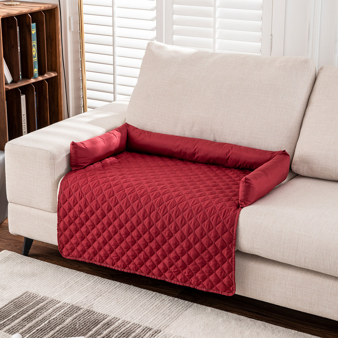 red furniture protector dog bed on couch