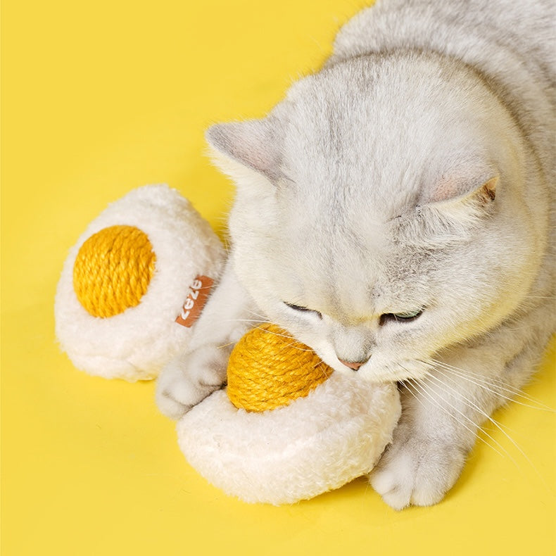 Cat playing independently with boiled egg sisal rope ball toy 