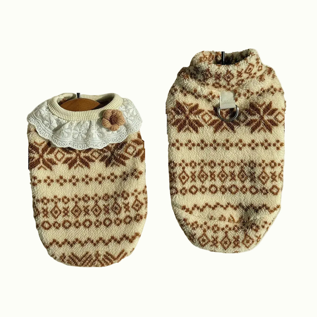 Two dog sweaters with patterned designs on a white background