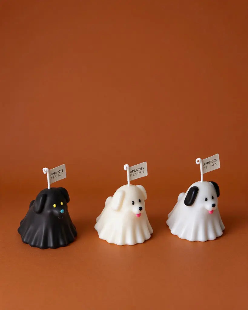 Cute puppy aromatherapy candle gift set featuring black, grey and white dog-shaped scented candles made with natural plant wax