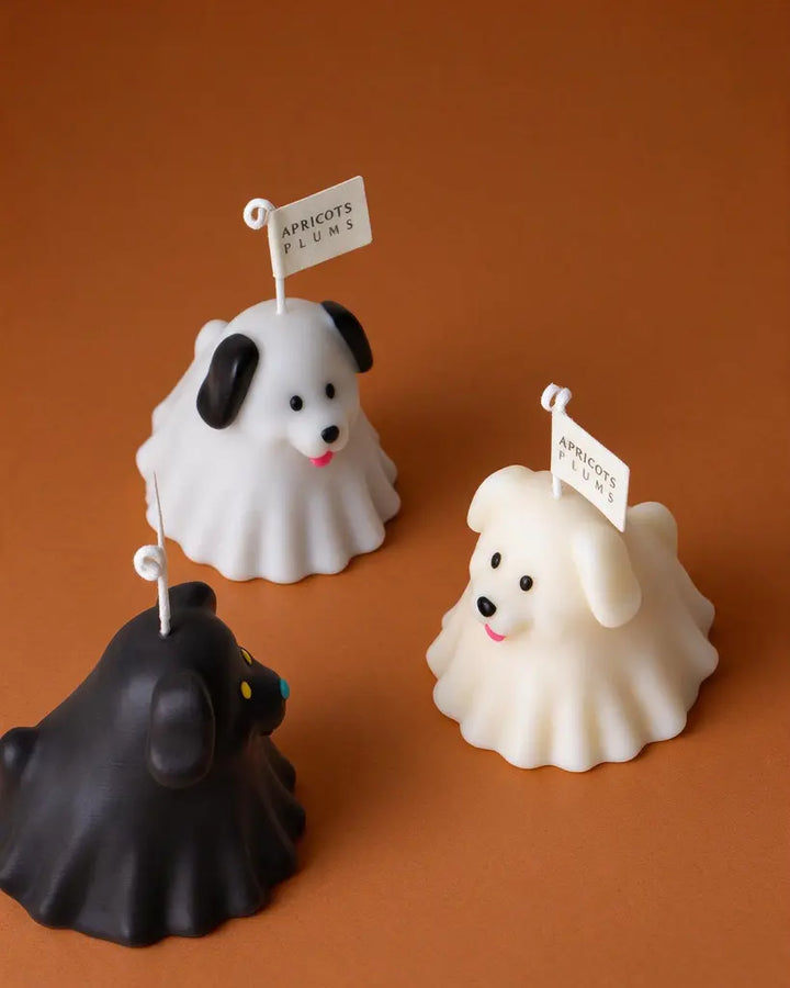 Cute puppy aromatherapy candle gift set featuring black, grey and white dog-shaped scented candles made with natural plant wax