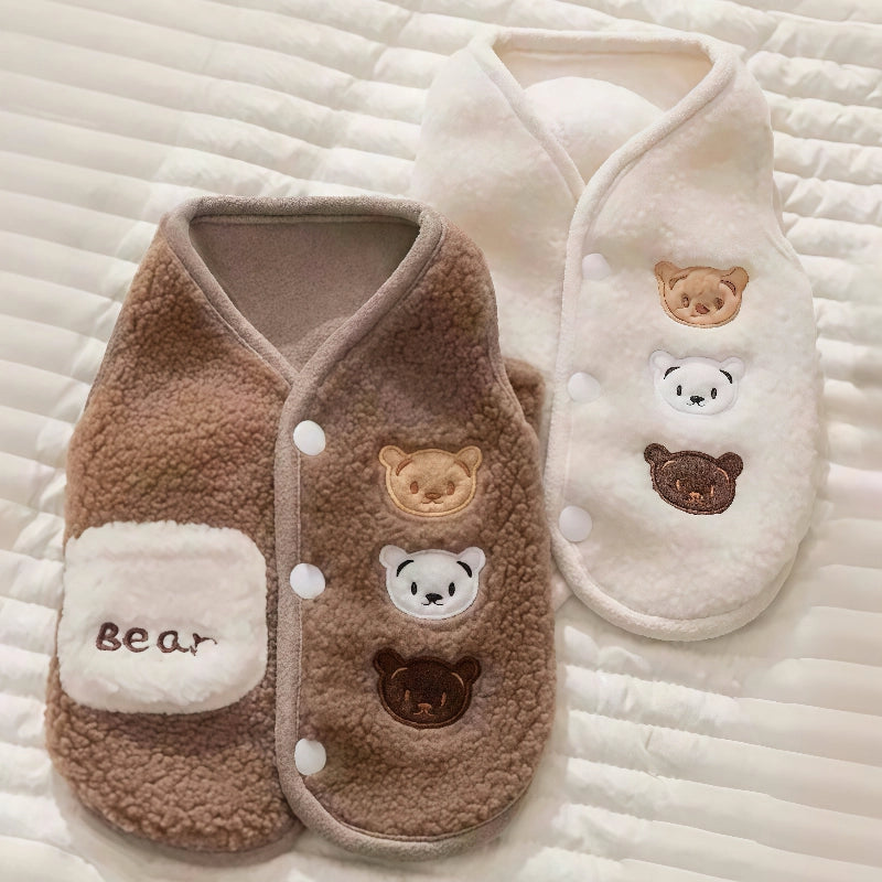Brown and white pet outfit with bear designs on a textured surface