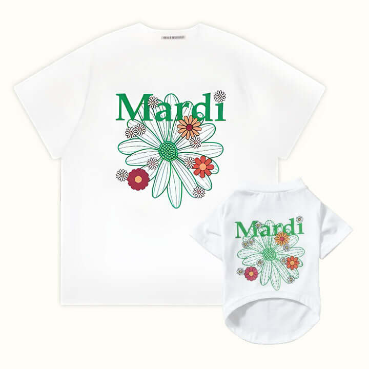 White pet and owner matching t-shirts with green &