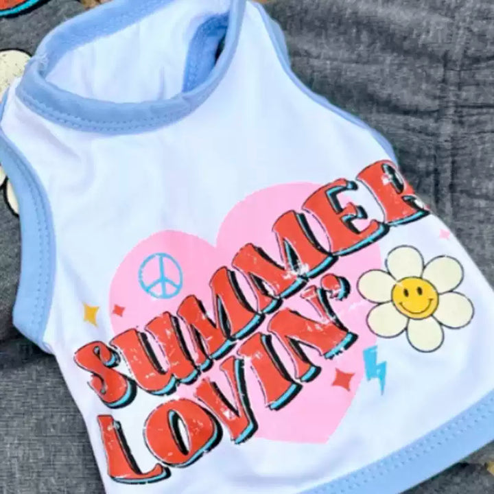 Tee with 'Summer Lovin' text and floral design on a textured surface