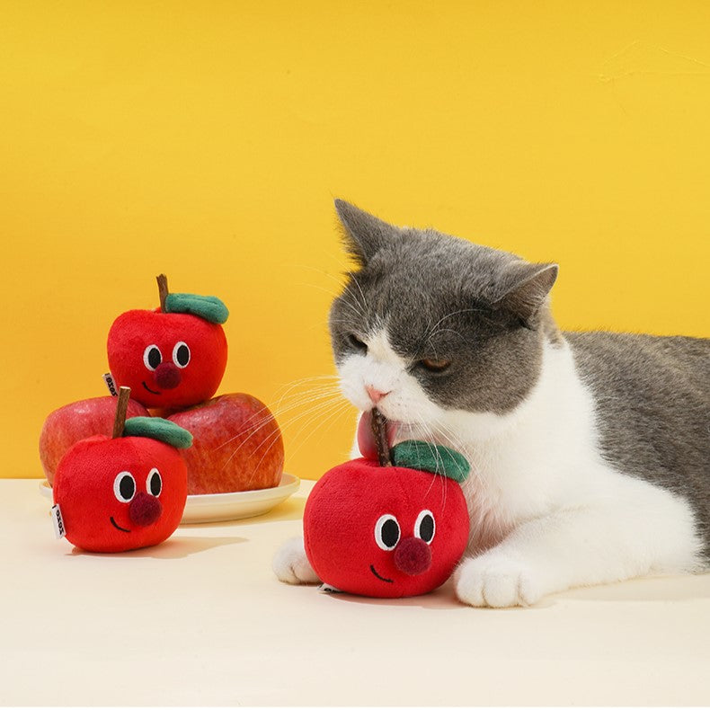 Cat chewing on textured apple wood catnip wand 