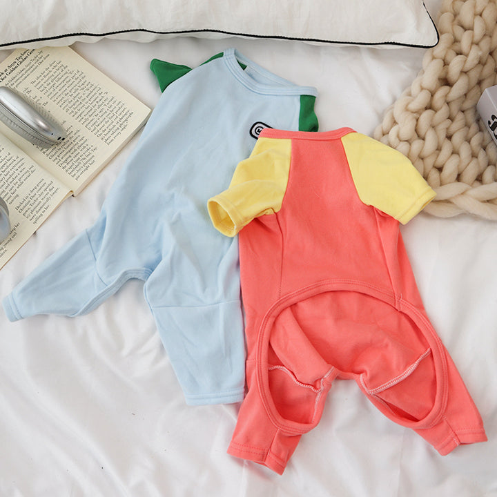 Two pet jumpers, one light blue and one LightCoral, on a textured surface.