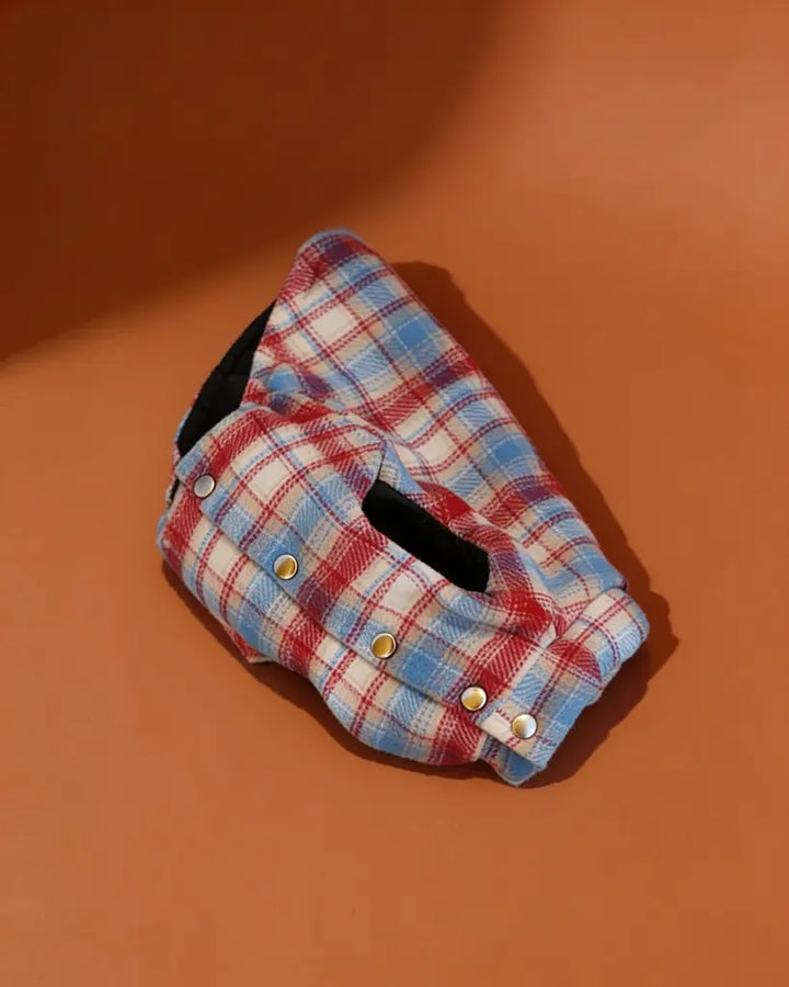 a blue and red plaid padded winter dog jacket