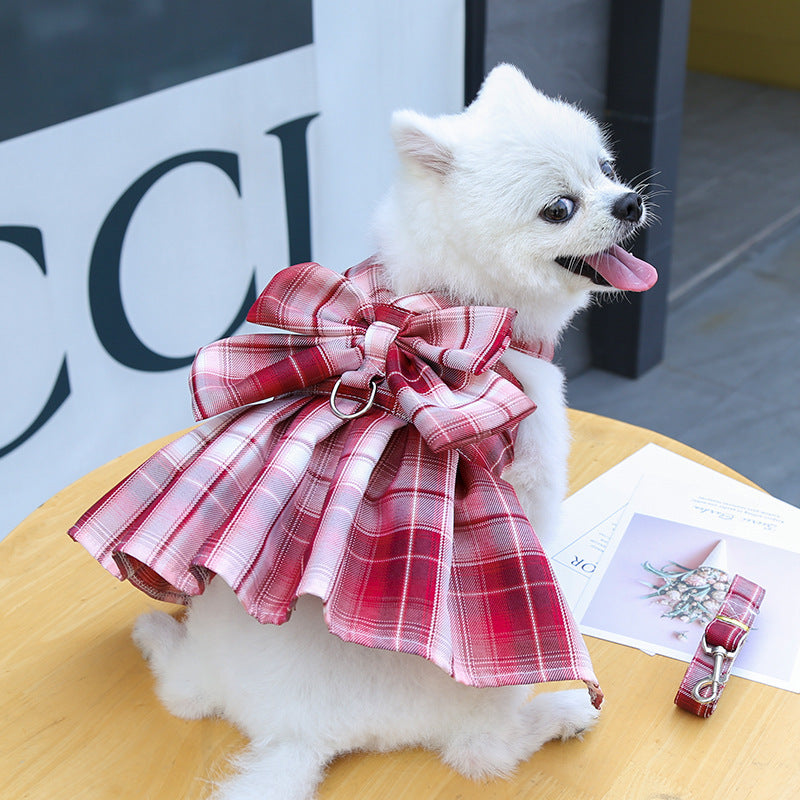 dog wearing red plaid bow design dress harness
