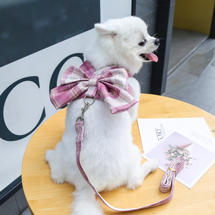dog wearing pink plaid bow design vest harness