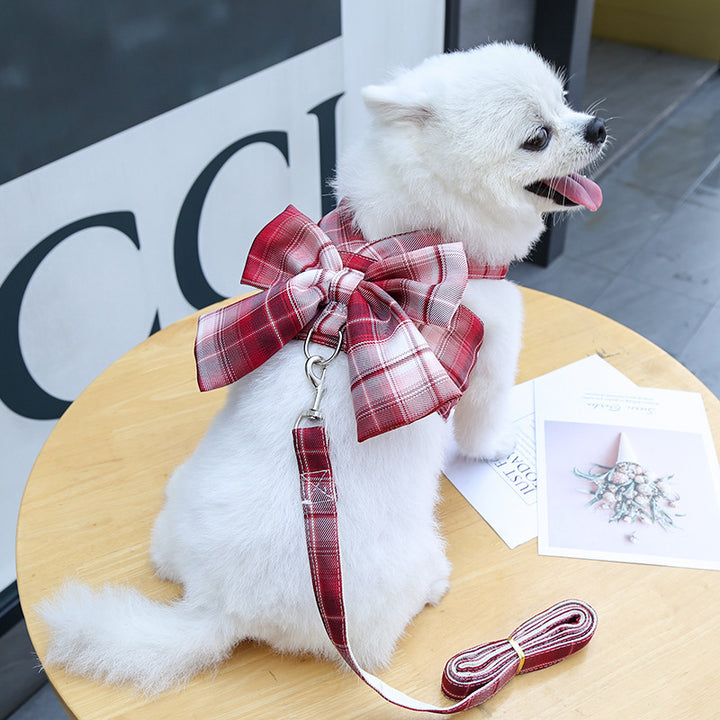 dog wearing red plaid bow design vest harness
