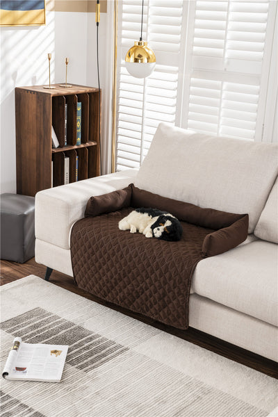 dog sleeping on brown bolster mat on couch